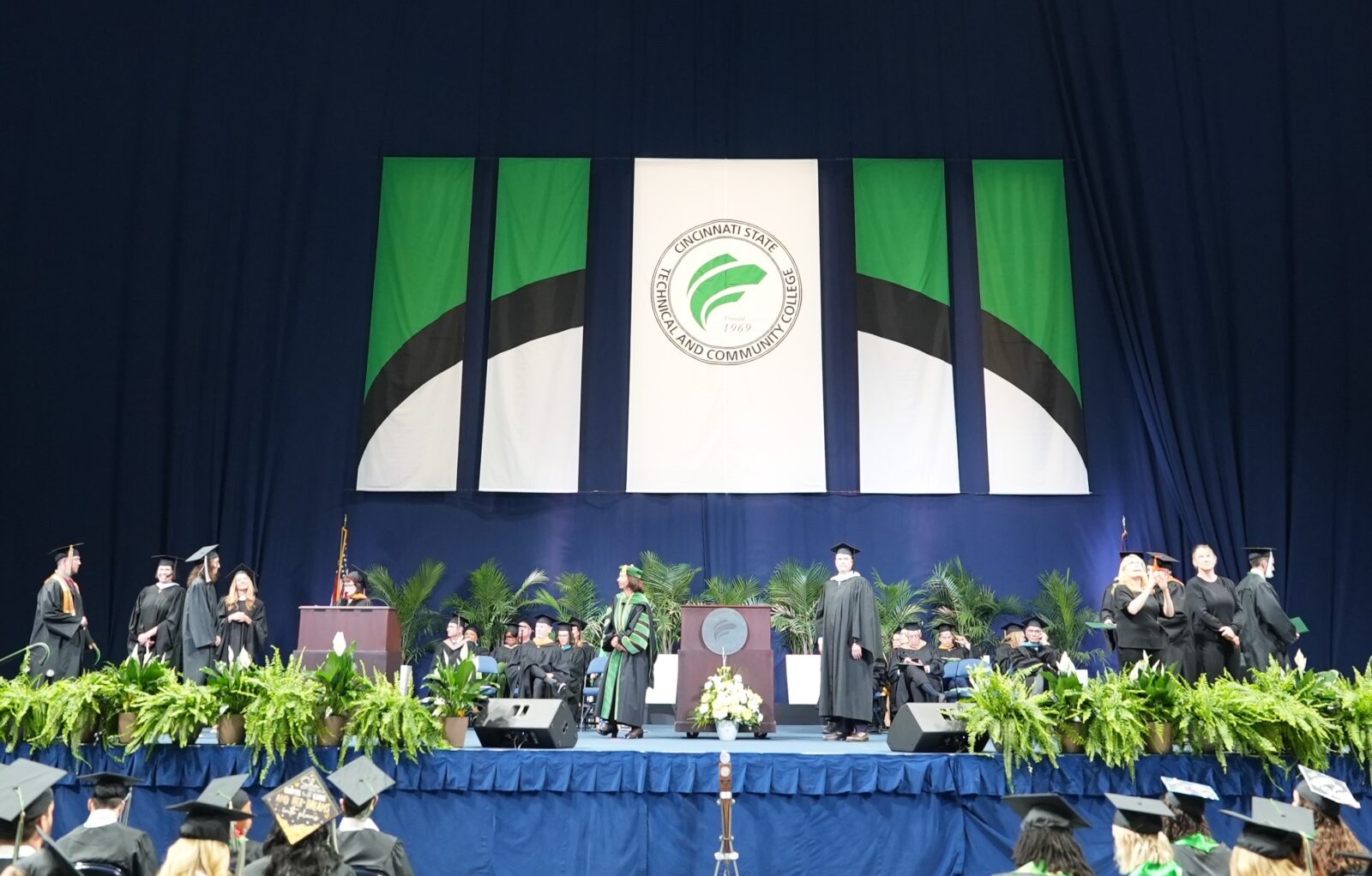 Graduates crossing the stage