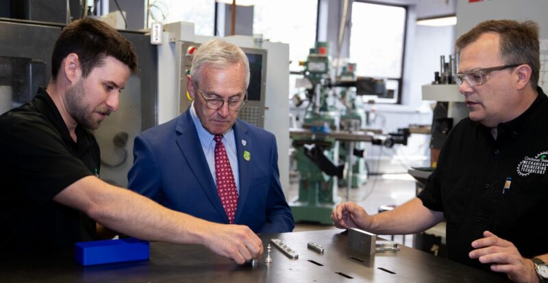 Faculty members Zane Decker and Matt Spetz described advanced manufacturing training to Lt. Gov. Tressel