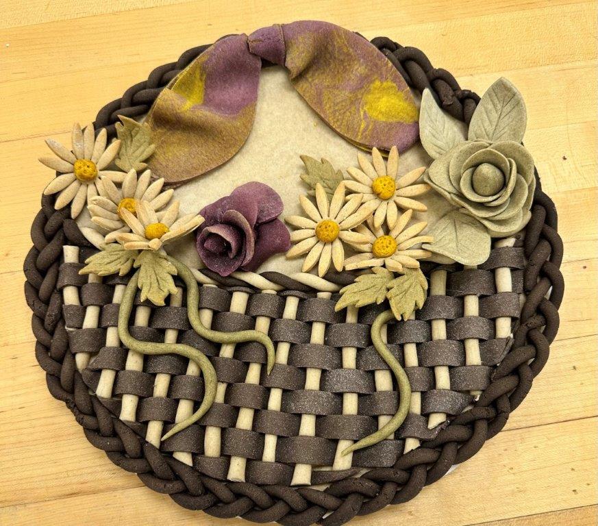 "Dead dough" sculpture - braided bottom, flowers in the middle, bow on top
