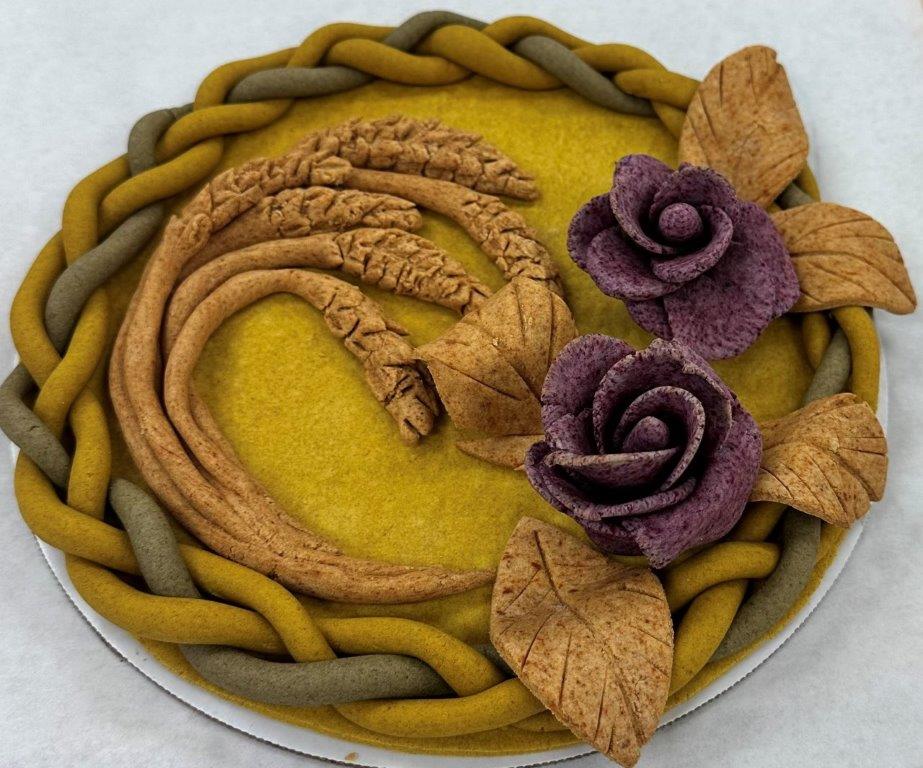 "Dead dough" sculpture - purple flowers, brown leaves & stalks of wheat, green & yellow braided border