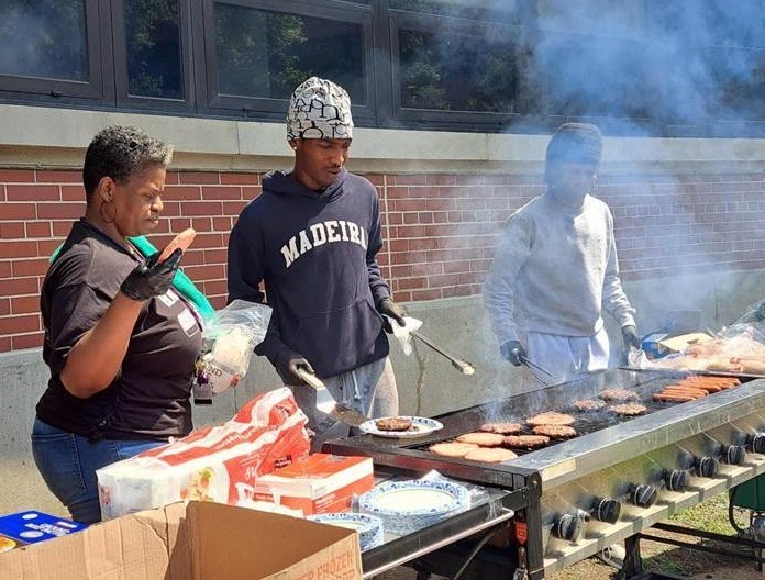Volunteers grilling lunch at the Back to School event - 8-23-25
