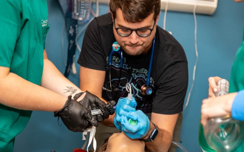 Students assisting a 