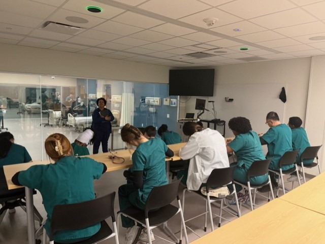 Students reflecting on their experiences after completing the simulation