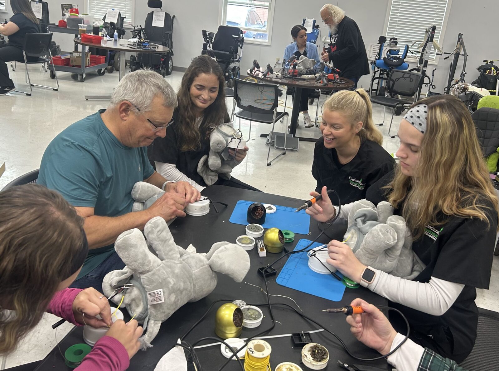 OTA students modified toys during a visit to "May We Help" 