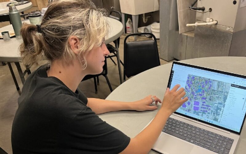 Peyton Majerski on the job at the Cincinnati Zoo, examining maps of the Zoo's infrastructure on her computer