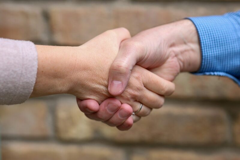 Two people are shaking hands